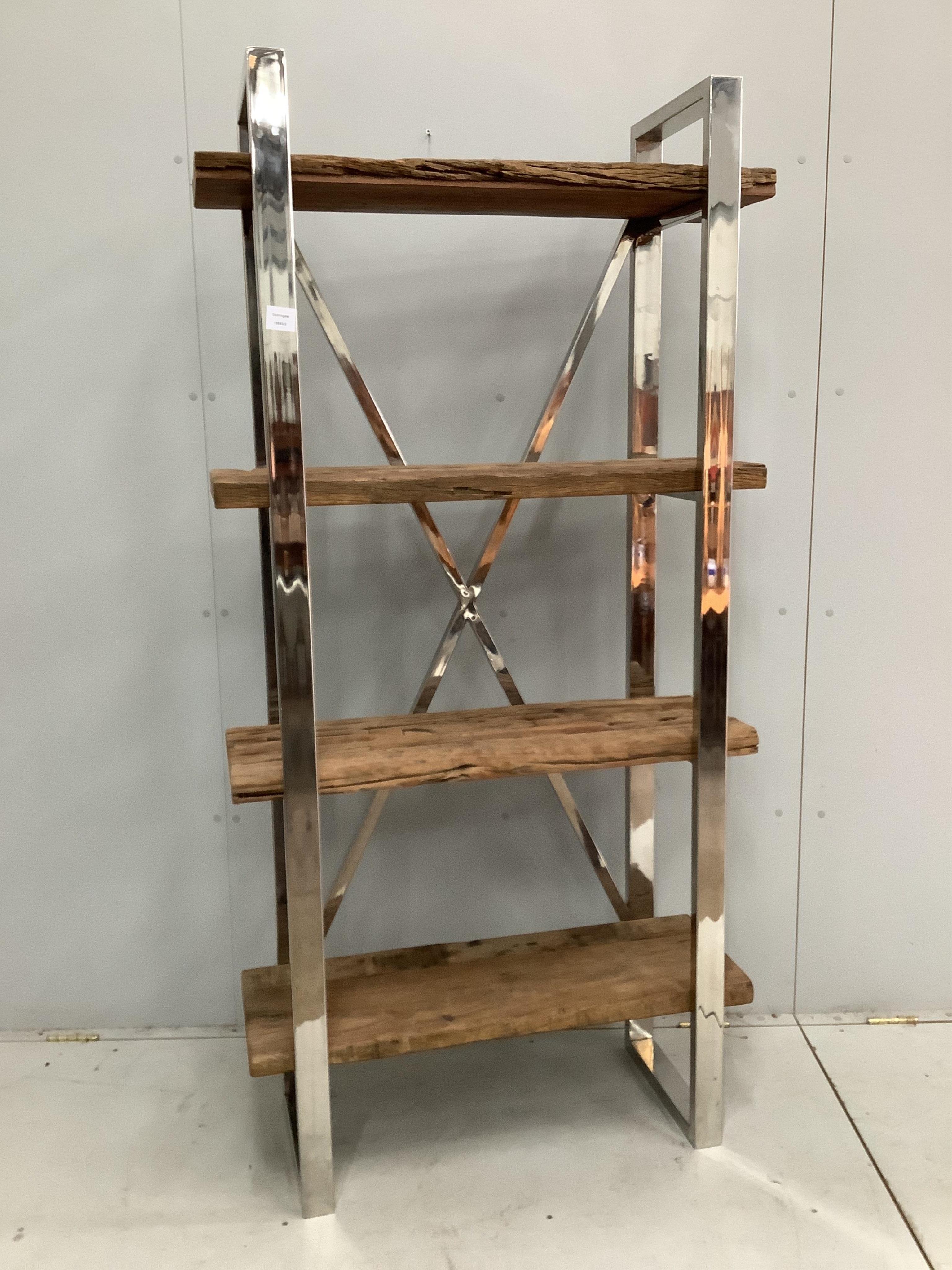 A Contemporary weathered hardwood and chrome set of open shelves, made from old train rail track woods, width 90cm, height 181cm. Condition - good
